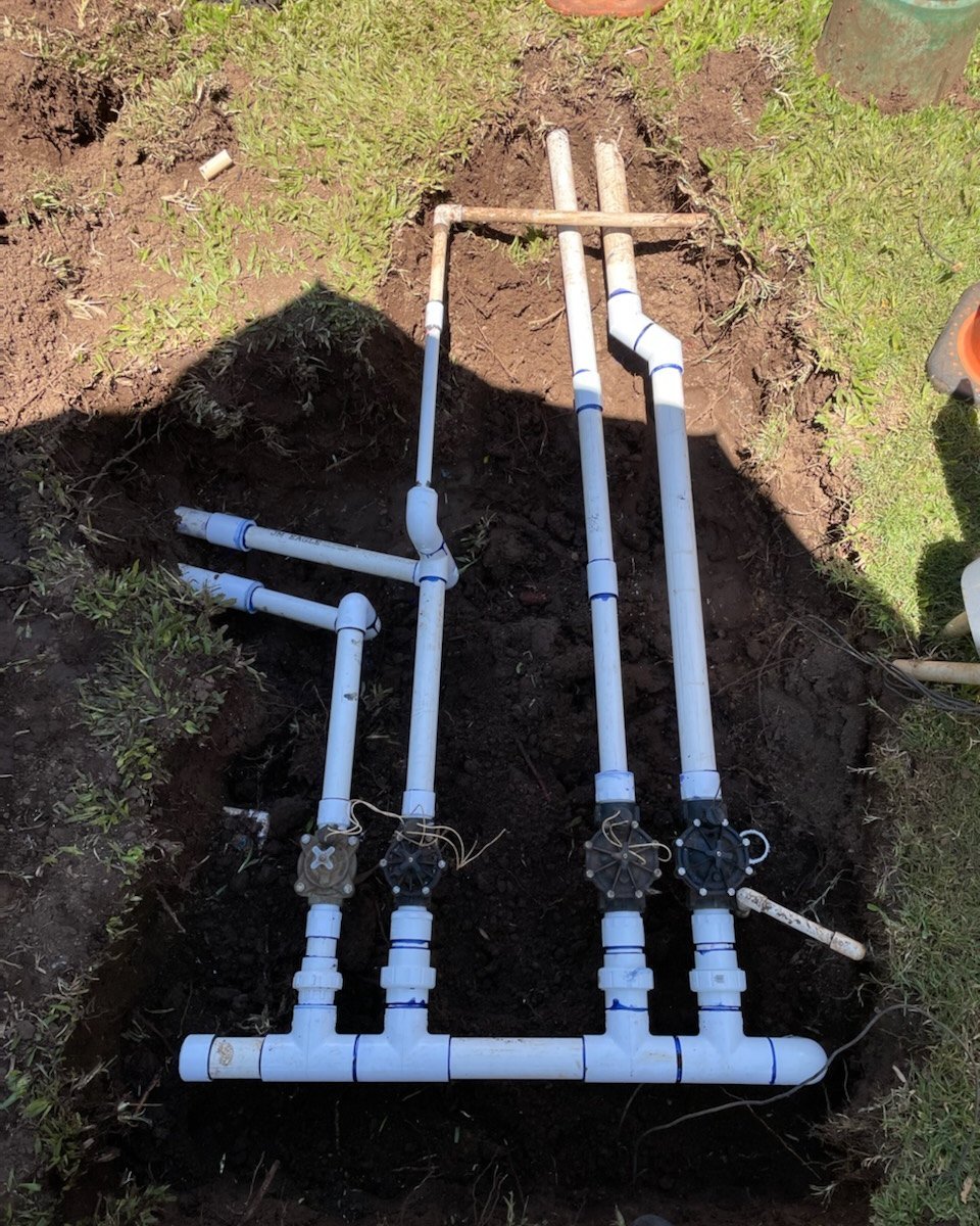 Irrigation and sprinkler line work in progress on a Maui property